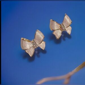 White bow stud earrings gold plated with crystals